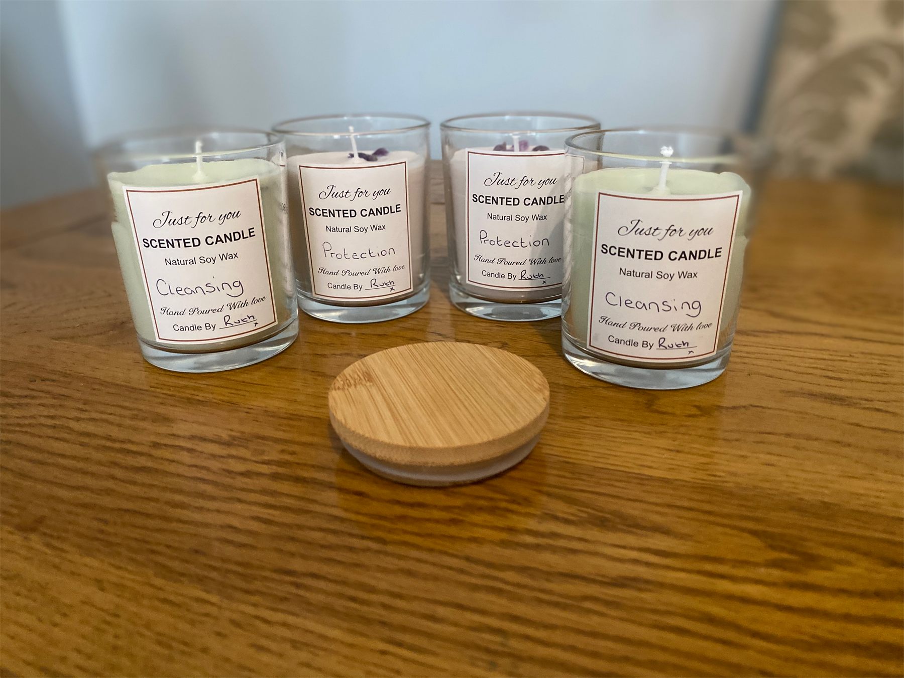 A row of hand-poured Alternative Healings scented candles